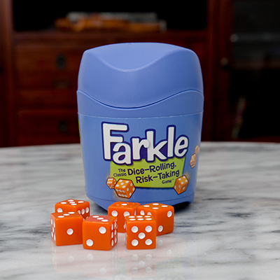 FARKLE™ Dice Game - Become a Farkle Fanatic™ with this dice-rolling, risk-taking game.  Take a risk, or play it safe in this fun game of strategy and luck. Game includes 6 dice, dice cup with lid and rules.  For 2 or more players, ages 8+.