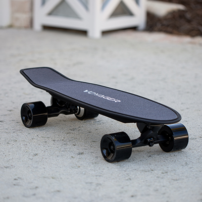 VIVITAR<sup>&reg;</sup> Neutrino Skateboard - This light motorized skateboard works great for cruising or commuting.  Weighing at 9.5 lbs, this skateboard features a max speed of 12.5 MPH, ability to travel up to 7 miles on a charge, Bluetooth<sup>&reg;</sup> remote control for monitoring the battery in the board and remote, and 350 watt brushless motor.  With the intelligent controller, you can also easily toggle between slow and fast modes.